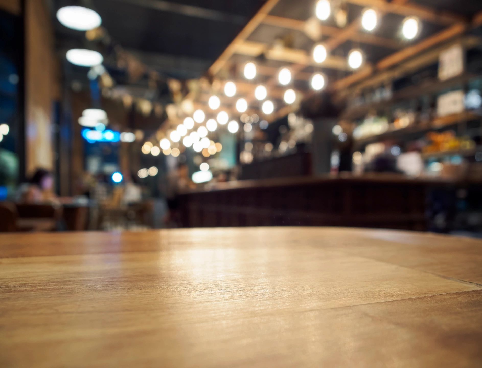 Blurred image of a restaurant bar.